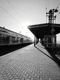 Train at railroad station against clear sky