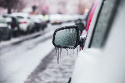Reflection of car on side-view mirror