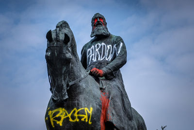 Low angle view of statue against sky