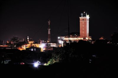 Illuminated buildings in city at night