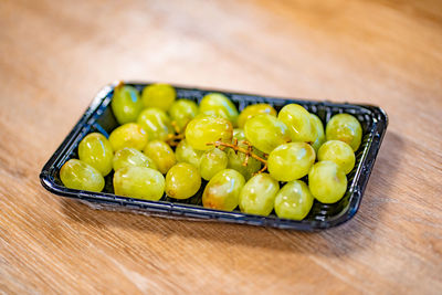 High angle view of fruits in plate on table