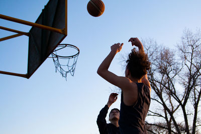 Portrait of teenager boys playing basketball