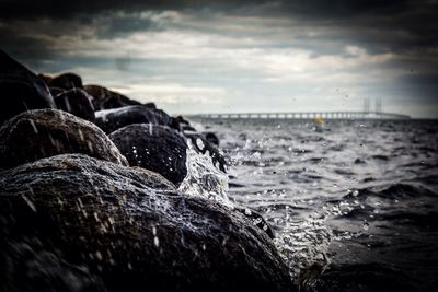 Scenic view of sea against cloudy sky