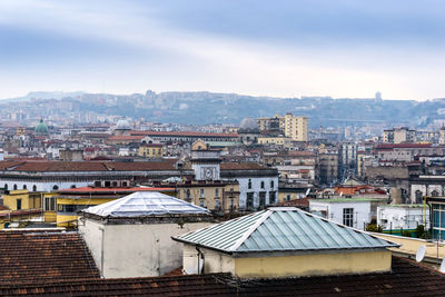 Houses in city against sky