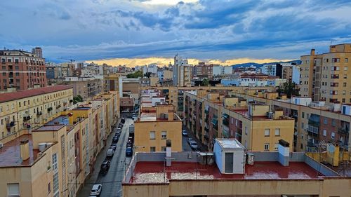 High angle view of buildings in city against sky