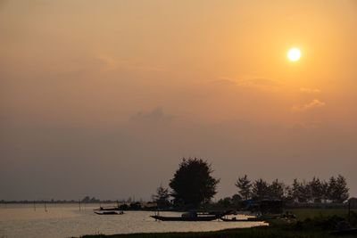 Scenic view of field against sky during sunset