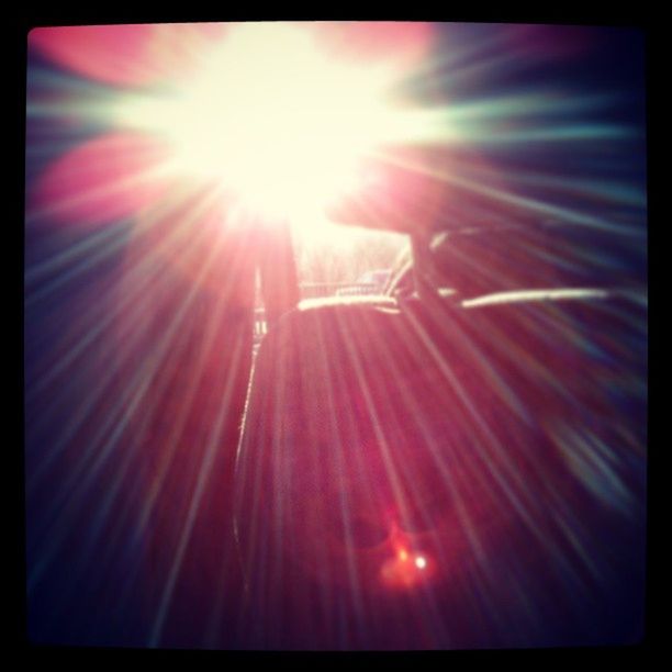 transfer print, sun, lens flare, sunbeam, auto post production filter, sunlight, bright, glowing, low angle view, silhouette, brightly lit, leisure activity, outdoors, sky, motion, back lit, lifestyles, arts culture and entertainment, sunny