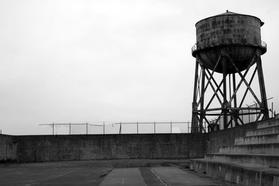Low angle view of water tower against clear sky