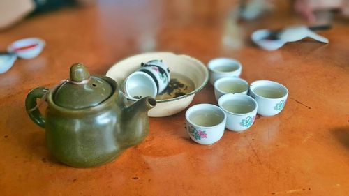 High angle view of teapot and chinese tea cups on table