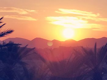 Scenic view of mountains against sky during sunset