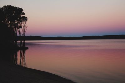 Scenic view of sea against orange sky