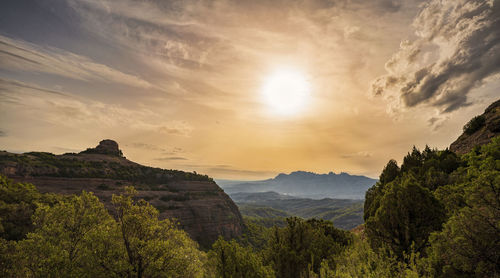 Scenic view of mountains against sky during sunset