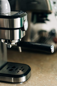 Close-up of machine part on table