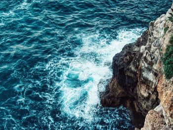 High angle view of rocks in sea