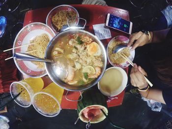 Directly above shot of man preparing food on table