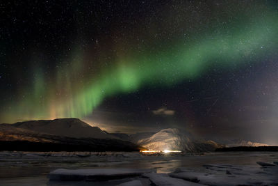 Scenic view of sea against sky at night