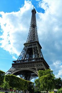 Low angle view of tower against cloudy sky