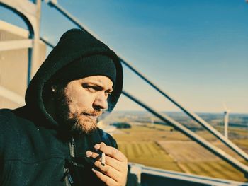 Man smoking cigarette outdoors 