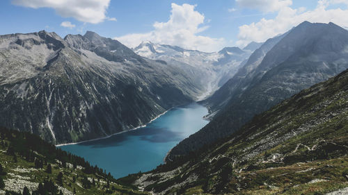 Scenic view of river with mountains in background