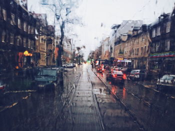 View of wet railroad tracks during rainy season