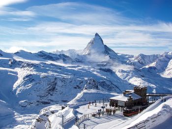 Scenic view of snow covered mountains