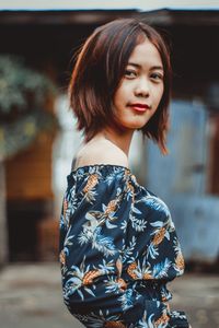 Portrait of woman standing outdoors