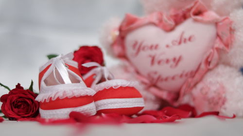 Close-up of jewelry boxes by heart shape on table