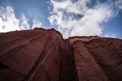 Low angle view of rock formation in desert against sky