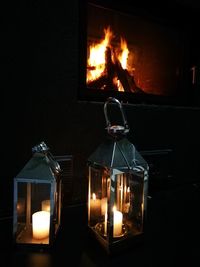 Close-up of illuminated candles at home