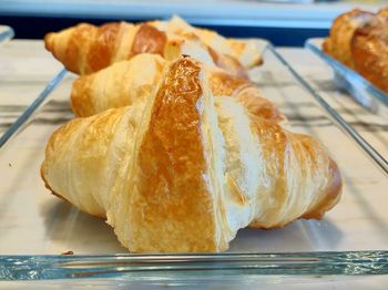 Close-up of croissants in plate on table