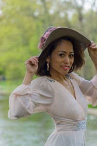 Portrait of smiling young woman in park