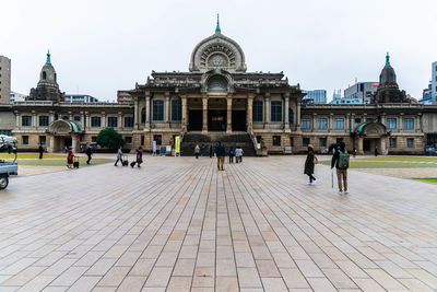 Group of people in front of historical building