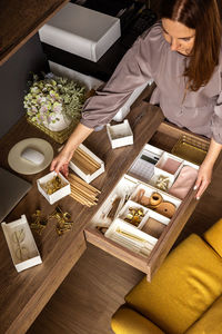 High angle view of woman preparing food on table