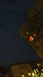 Low angle view of illuminated building at night