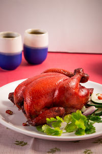 High angle view of chicken meat served in plate on table