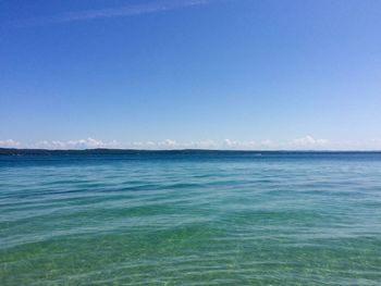 Scenic view of sea against clear blue sky