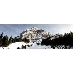 Scenic view of snow covered mountains