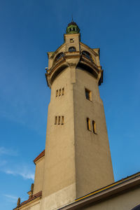 Low angle view of clock tower against sky