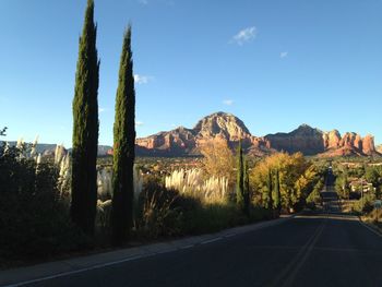 Empty road with mountains in background