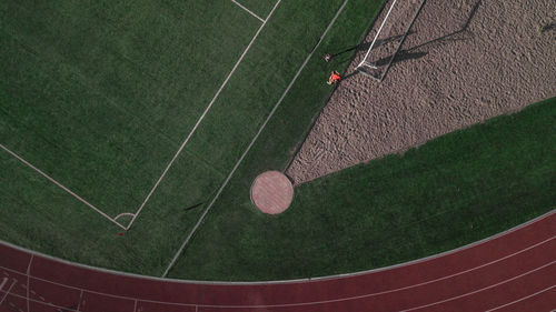 Aerial view of man on ground in stadium