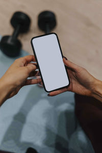 Woman's hands holding cell phone