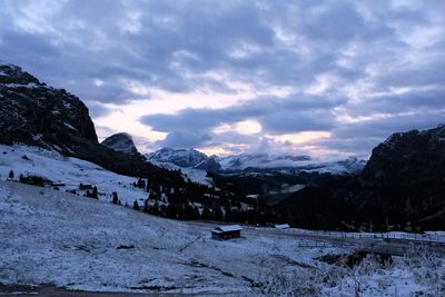 Scenic view of snow covered mountains against sky