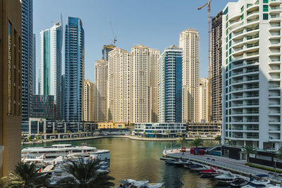 Dubai marina. modern buildings in city against sky