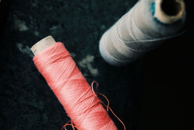 High angle view of thread spools on table