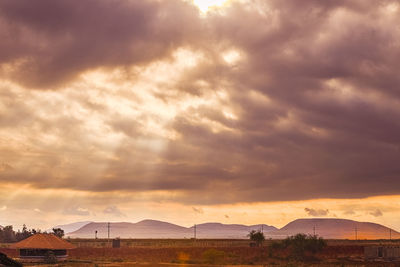 Scenic view of dramatic sky during sunset