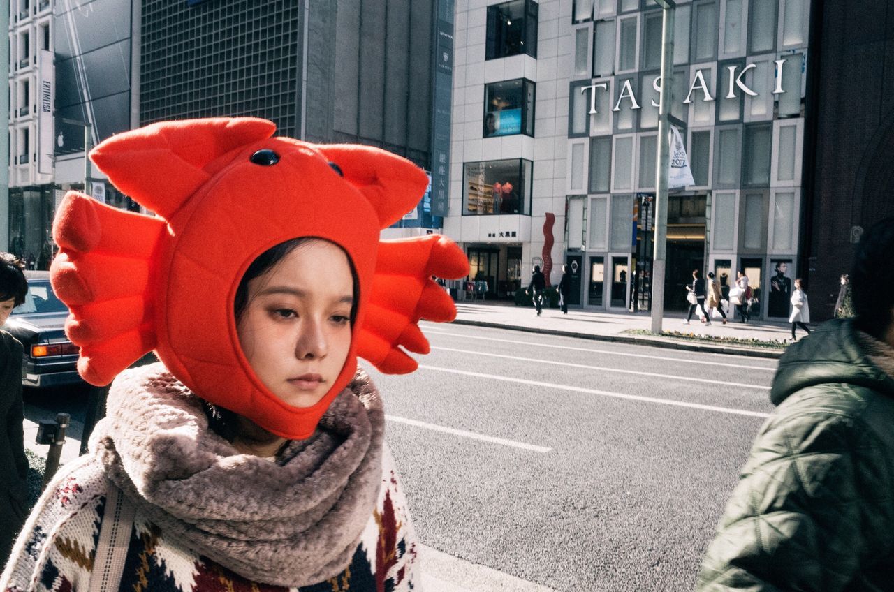 childhood, real people, warm clothing, lifestyles, one person, knit hat, outdoors, winter, front view, leisure activity, building exterior, city, day, cold temperature, close-up, portrait, snow, people