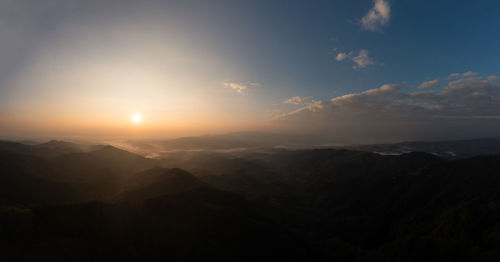 Scenic view of mountains against sky during sunset