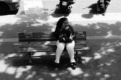 Young woman sitting outdoors