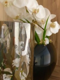 Close-up of white flower vase on table