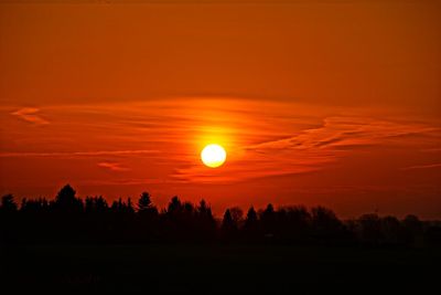 Scenic view of silhouette landscape against romantic sky at sunset